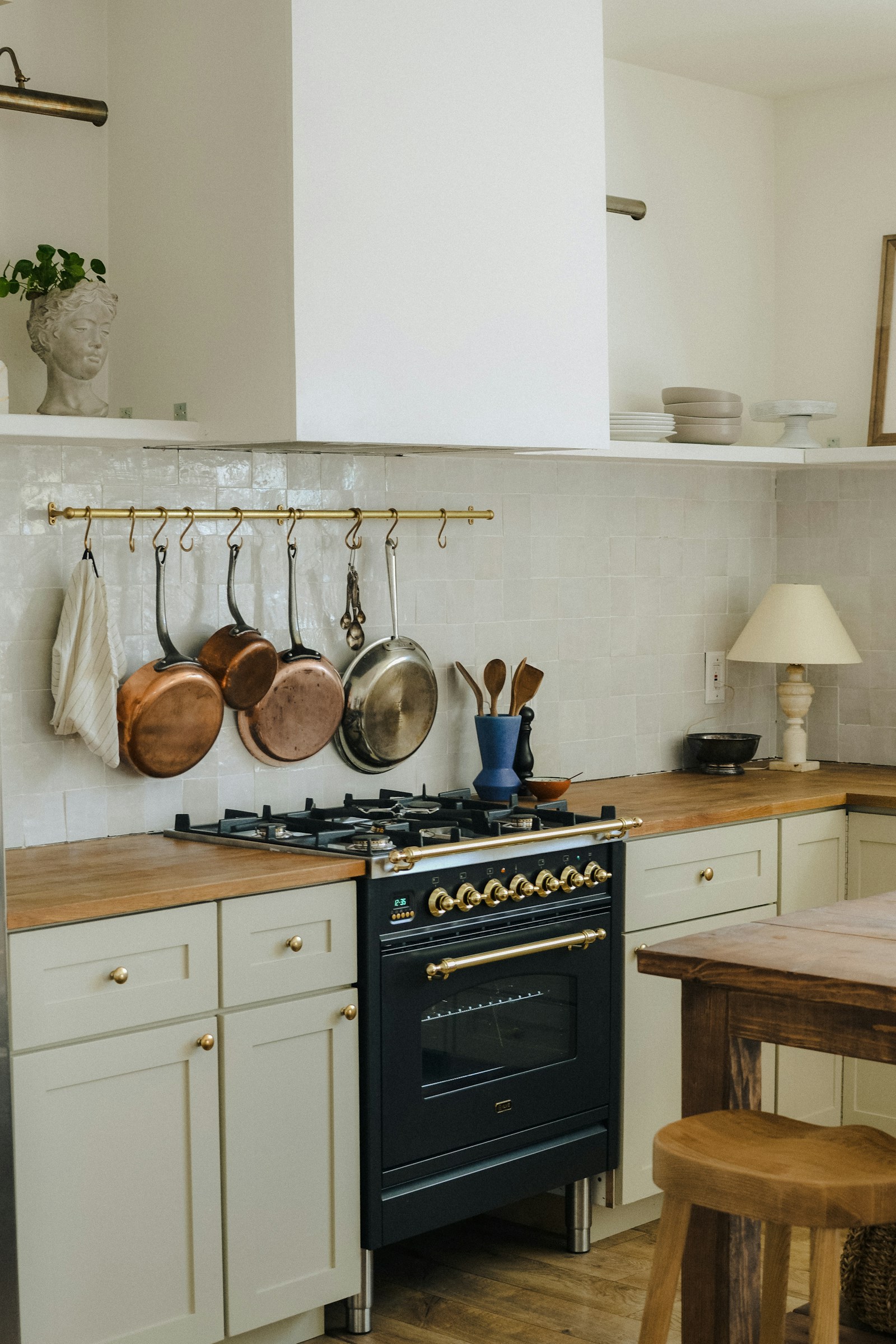 Monogram dual-fuel range with stainless and brass detailing — expert Monogram range repair