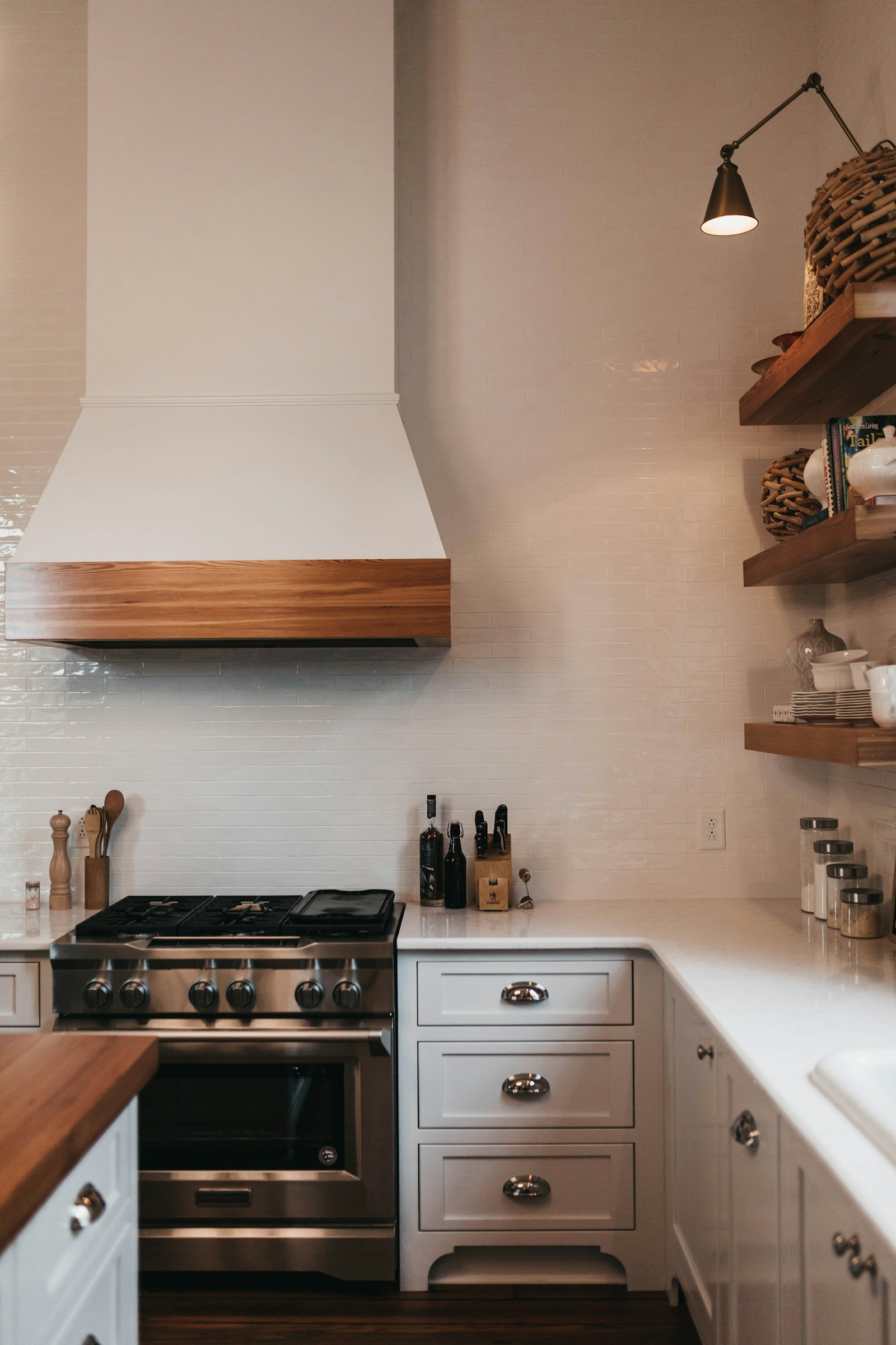 Monogram stainless range hood ventilation in a luxury kitchen — expert Monogram range hood repair