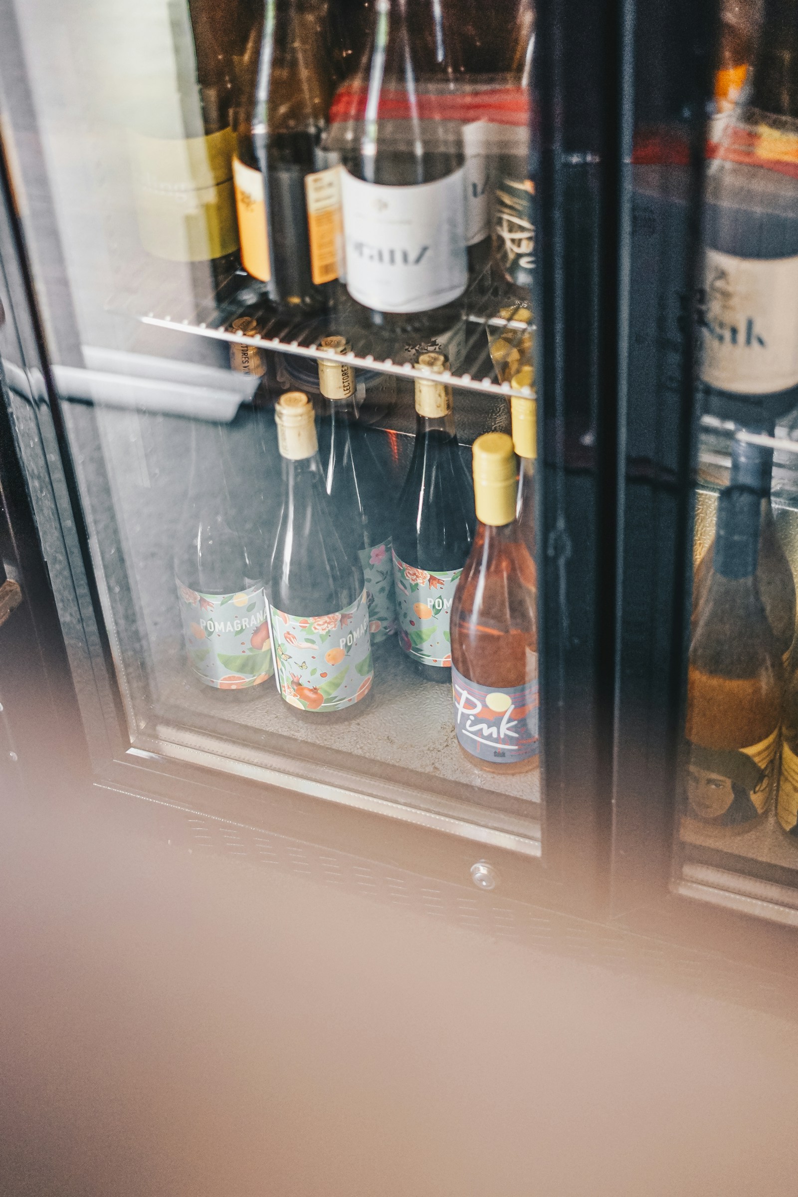 Monogram glass-door wine reserve displaying a full bottle collection — certified Monogram wine refrigeration service